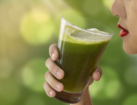 Girl hold glass of green celery juice for healthy drink in daily life. 
