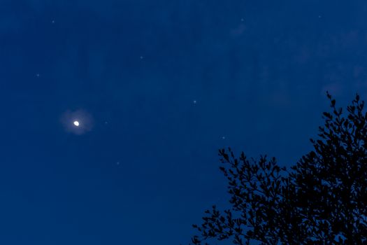 Half moon and stars on the sky night time background with copy space for text or design.