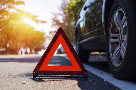 Red triangle, red emergency stop sign, red emergency symbol with  car stop and park on road.