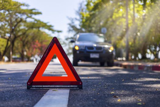 Red triangle, red emergency stop sign, red emergency symbol with  car stop and park on road.