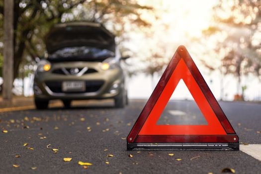 Red triangle, red emergency stop sign, red emergency symbol and  car stop and park on road.