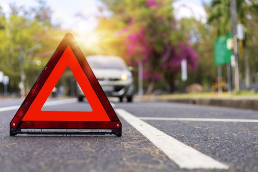 Red triangle, red emergency stop sign, red emergency symbol and  car stop and park on road.