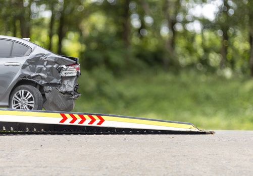 accident Car Slide on  truck for move. white car have damage by accident on road take with slide truck move . 