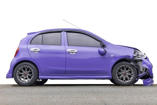 Purple color car big damaged and broken by accident on city street parking can not drive any more. Save with clipping path.