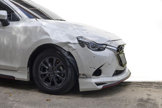 Front of white color car damaged and broken by accident isolated on white background. 