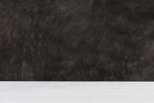 white wood table and  raw cement background. 