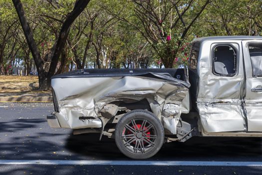 Back of gray color car big damaged and broken by accident on city street parking can not drive any more. With copy space for text or design