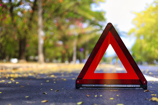 Red triangle, red emergency stop sign, red emergency symbol on road. With copy space for text or design
