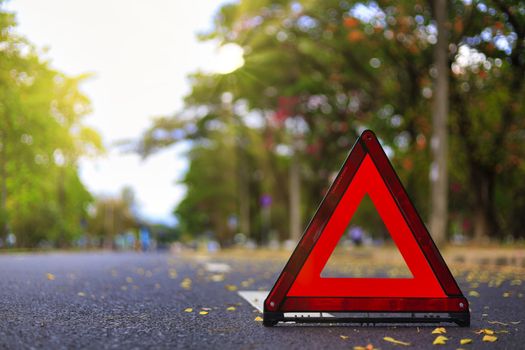 Red triangle, red emergency stop sign, red emergency symbol on road. With copy space for text or design
