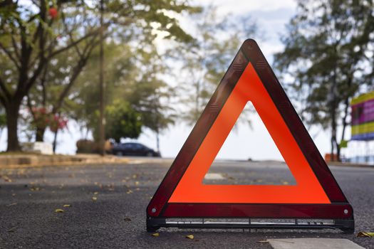Red triangle, red emergency stop sign, red emergency symbol on road. With copy space for text or design