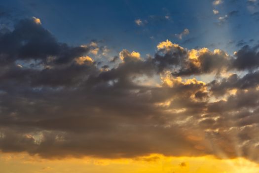 Sky with cloud and sun ray yellow and blue color background. With copy space for text or design.