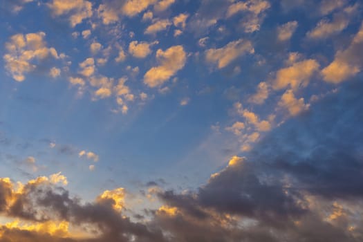 Sky with cloud and sun ray yellow and blue color background. With copy space for text or design.