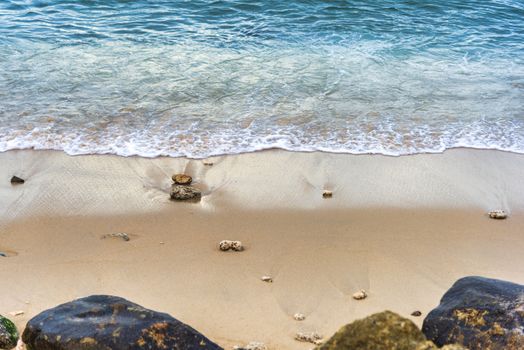 Top view Soft wave from sea come to wet sand beach background. With copy space for text or design