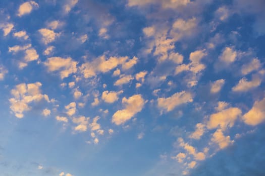 Sky with cloud and sun ray yellow and blue color background. With copy space for text or design.