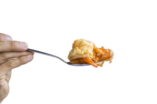 Close up Woman hand hold a spoon with shrimp from Tom Yum Kung isolated on white background. Save with clipping path.