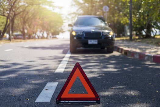 Red triangle, red emergency stop sign, red emergency symbol with  car stop and park on road.
