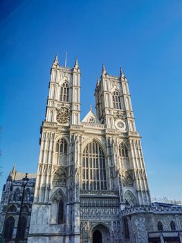 Westminster Abbey photography during sunset against bright blue sky.