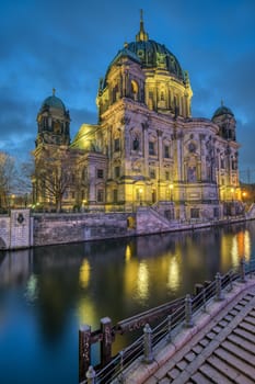 The Berlin Cathedral with the river Spree at twilight