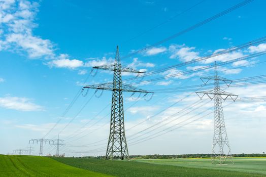 High-voltage lines on a sunny day seen in Germany