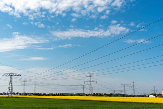 High-voltage power lines in an agricultural area seen in Germany