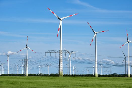 Overhead power lines and wind engines seen in Germany