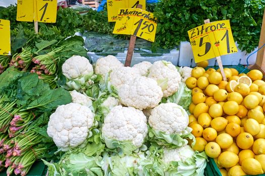 Cauliflower and lemons for sale at a market