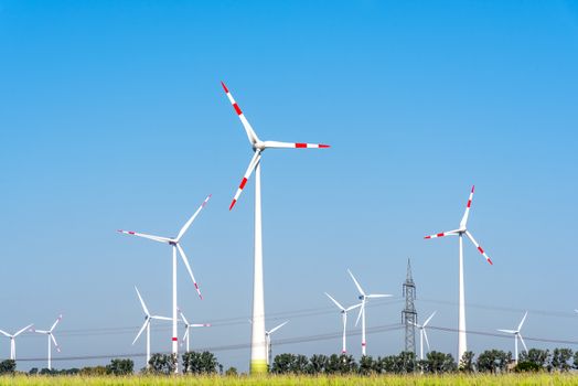 Wind turbines and some overhead power lines seen in Germany