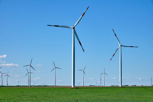 Wind turbines in an agricultural area seen in Germany