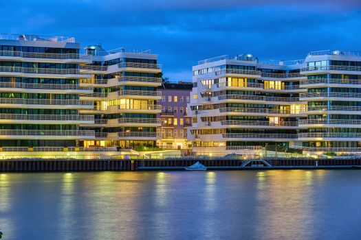 Modern apartment buildings at the river Spree in Berlin at night