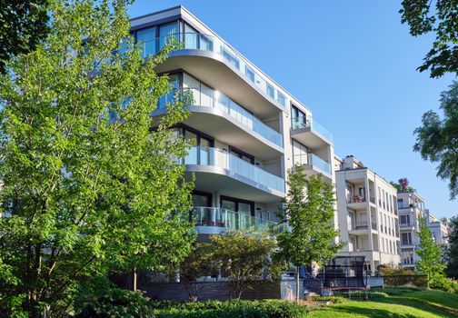 Modern apartment house with a green garden seen in Berlin, Germany