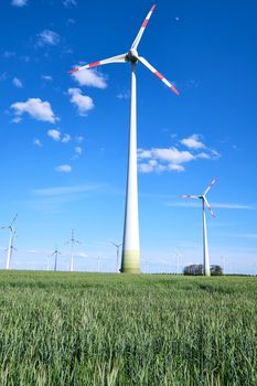 Wind energy generators in a cornfield seen in Germany