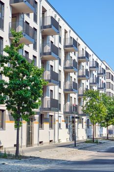 Street with new apartment buildings seen in Berlin, Germany