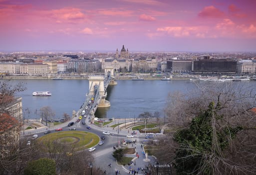 Budapest, Hungary - March 27, 2018 :Chain bridge on Danube river in Budapest city in Hungary. Urban landscape panorama with old buildings at dawn.