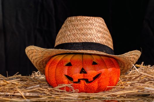 Halloween scary pumpkin with a smile in autumn forest