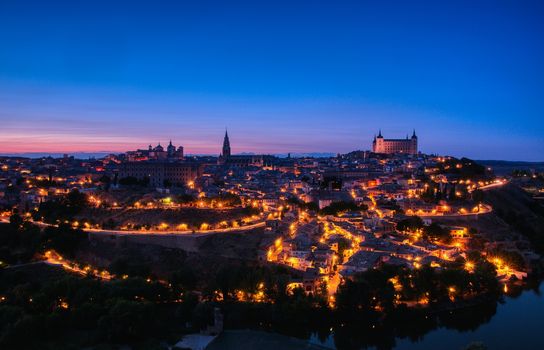 Panoramic view of the medieval center of the city of Toledo, Spain. It features the Cathedral and Alcazar of Toledo, Spain.