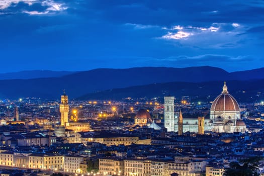 Duomo Santa Maria Del Fiore and tower of Palazzo Vecchio at sunset in Florence, Tuscany, Italy