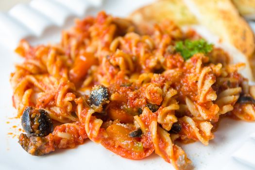 Traditional Italian pasta with tomato sauce cuisine.