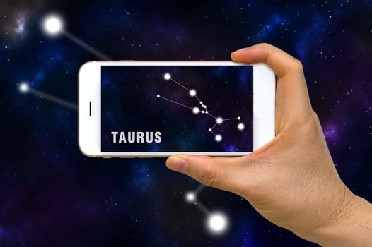Concept of augmented reality, AR, of Taurus zodiac constellation app on smartphone.