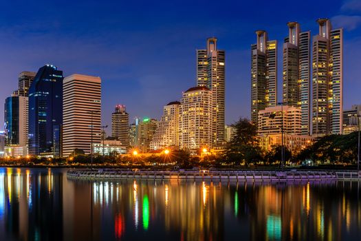 Modern buildings in office district at night in Bangkok, Thailand.