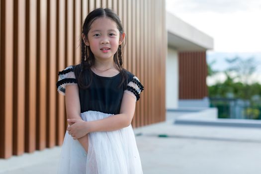Portrait of cute Asian child with joyful face.