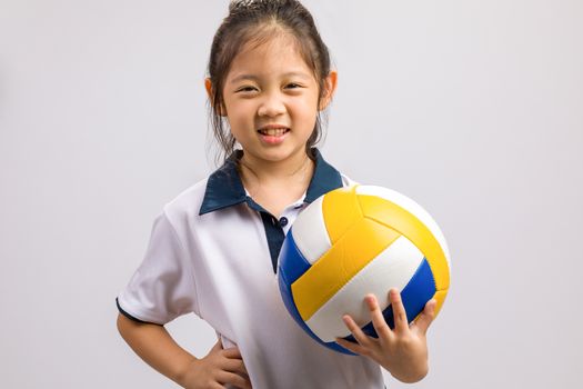 Kid holding ball, studio shot, isolated on white.