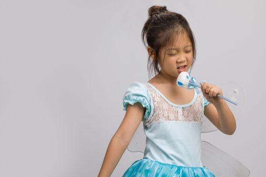 Kid in ballet dress, isolated on white background.
