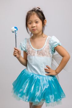 Ballerina in ballet dress, isolated on white background.