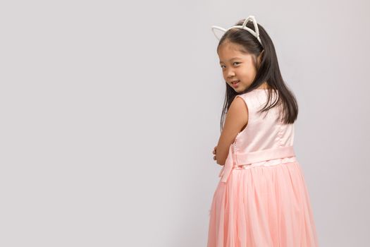 Kid with cat ear headband, isolated on white background.