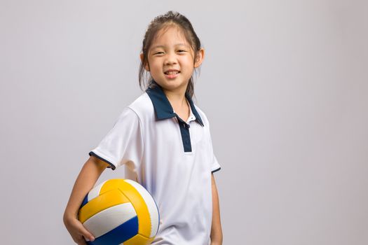 Kid holding ball, studio shot, isolated on white.