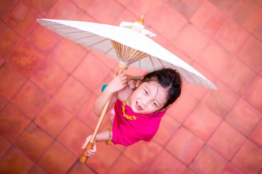 Child, Thai girl, in traditional Thai costume.