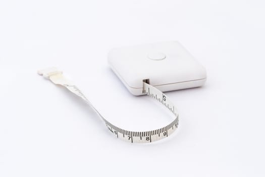 Studio shot of measuring tape isolated on white background.