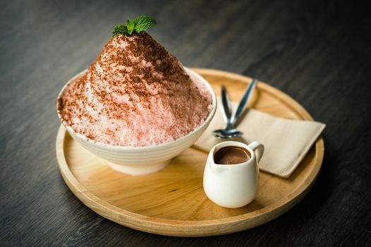 Bingsu or Korean shave ice with chocolate sauce on top.