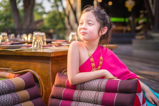 Child, Thai girl, in traditional Thai costume.