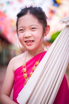 Child, Thai girl, in traditional Thai costume.